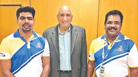 (from left) Tamil Thalaivas raider Pawan Sehrawat with owner Nimmagadda Prasad and head coach J Udaya Kumar