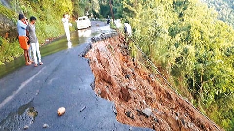 The damaged portion of Palani Road at Savarikadu in Kodaikanal following heavy rains on Wednesday