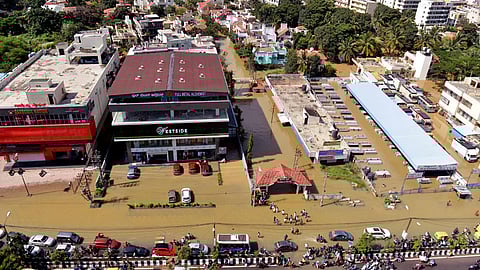 An aerial view shows a waterlogged locality following heavy rains at Rainbow Drive layout, Sarjapura, in Bengaluru.