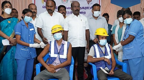 Two workers getting vaccinated in 35th mega vaccination drive on Sunday