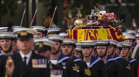 The coffin of Queen Elizabeth II is pulled on a gun carriage through the streets of London following her funeral service at Westminster Abbey, Monday Sept. 19, 2022.The Queen, who died aged 96 on Sept. 8, will be buried at Windsor alongside her late husband, Prince Philip, who died last year.