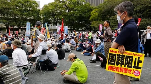 Former Prime Minister who was assassinated in July, has split Japan.