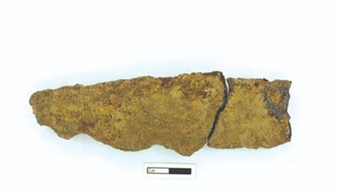 A knife made out of iron was found at a depth of 209 cm.