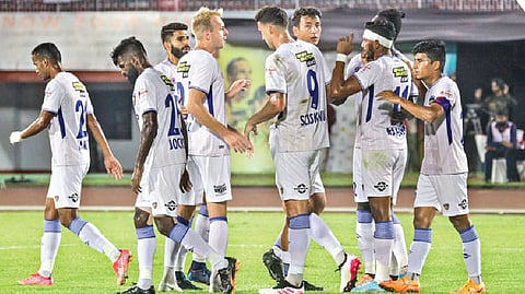 Chennaiyin FC players celebrate after scoring a goal