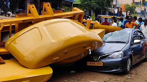 Metal parts fell on a car that was parked nearby