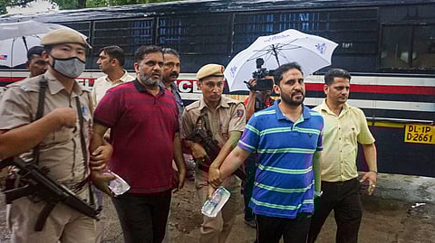 General Secretary of PFI Anis Ahmed (second, right) being produced to Patiala Court