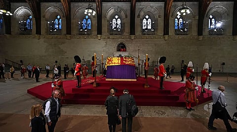 Members of the public file past the coffin of queen Elizabeth II, inside Westminster Hall, at the Palace of Westminster, in London