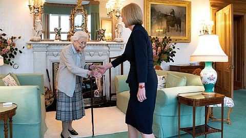 Liz Truss was seen in an official photograph shaking hands with the monarch.
