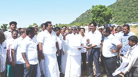 PWD Minister EV Velu inspecting the site at Keelakarai village near Alanganallur, for setting up a stadium for Jallikattu