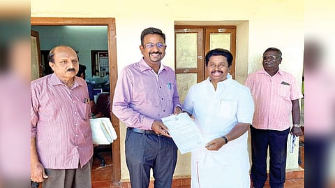 DMK MLA G Anbalagan handing over the petition to Collector Dinesh Ponraj