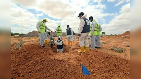 Remains Search department officials in Libya mass graves
