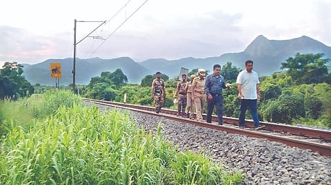 Officials inspecting the measures taken along the railway track to prevent elephant deaths in Coimbatore on Wednesday