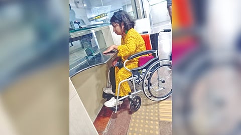 A wheel-chair user at the ticket counter in Ekkattuthangal Metro station