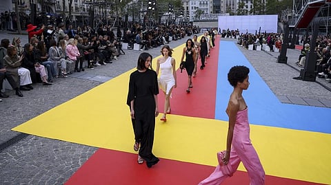 Models wearing creations for the Stella McCartney ready-to-wear Spring/Summer 2023 fashion collection presented Monday.
