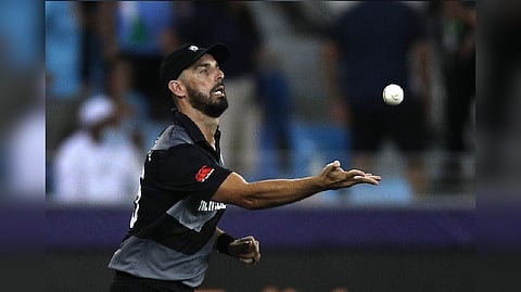 New Zealand's Daryl Mitchell celebrates after taking a catch to dismiss India's KL Rahul