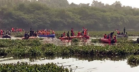 A rescue operation underway after a cable bridge collapsed in the Machchhu river, in Morbi on Monday. Over 134 casualties were reported in the incident.