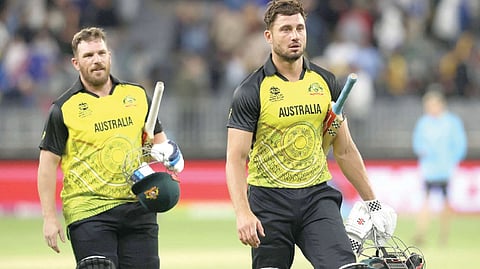 Australia?s Aaron Finch (left) and Marcus Stoinis walk off the field after their win.