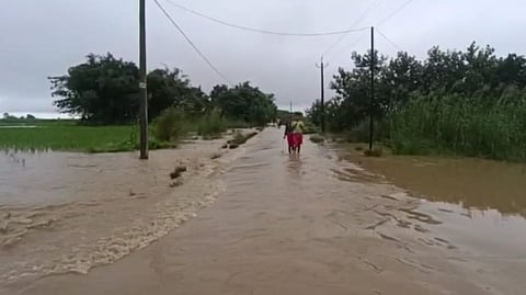 People walking through floods