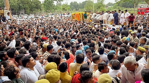 People gather to pay tribute to the mortal remains of Samajwadi Party founder Mulayam Singh Yadav, at his native village Saifai in Etawah district on Tuesday.