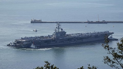 U.S. aircraft carrier USS Ronald Reagan is escorted into port in Busan