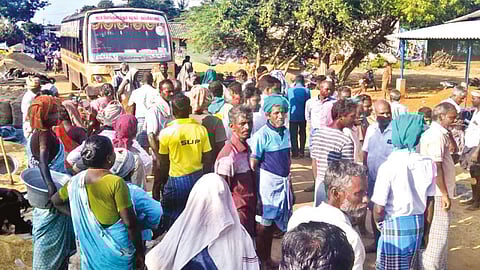 Farmers staging a road blockade protest near Alangudi DPC in Thanjavur on Friday