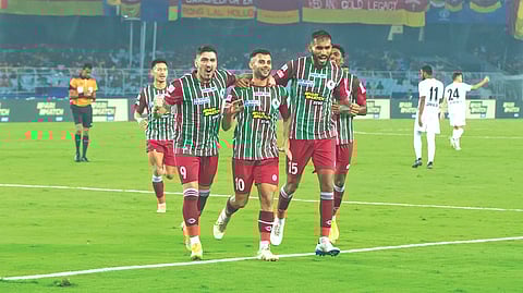 ATK Mohun Bagan players celebrate after scoring a goal.