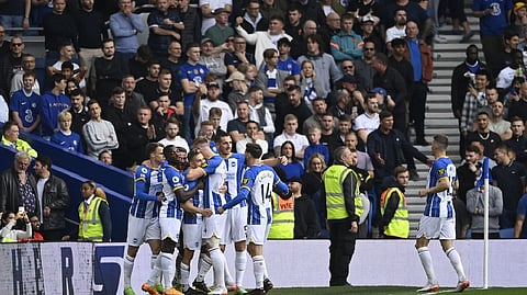 Brighton & Hove Albion's Leandro Trossard celebrates scoring their first goal with teammates