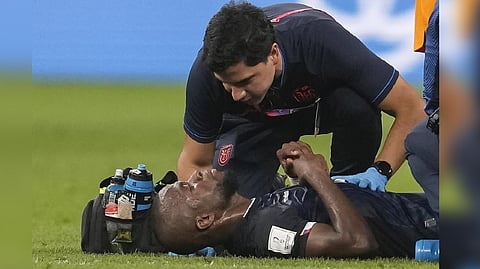 Ecuador's Enner Valencia is attended by medical personnel during the World Cup group A soccer match between Netherlands and Ecuador, at the Khalifa International Stadium in Doha, Qatar