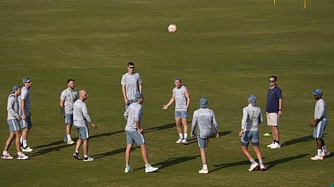 England's Ollie Pope, center, and teammates play with soccer ball during a training session, in Rawalpindi, Pakistan, Monday, Nov. 28, 2022. England's team arrived in Pakistan to play three-test cricket matches starting from Dec. 1.
