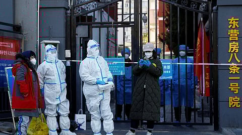 China shortens COVID quarantine times, eases flight curbs