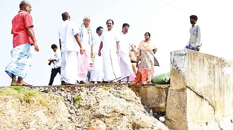 Minister Siva V Meyyanathan inspecting a breached canal in Mayiladuthurai on Wednesday