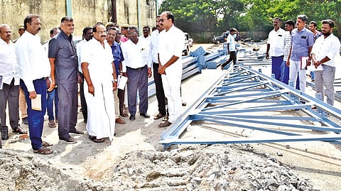 Food Minister R Sakkarapani inspecting ongoing construction of semi-godowns at TNCSC premises in Tiruvarur on Thursday