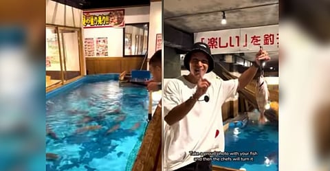 Customer with fish he caught at the restaurant