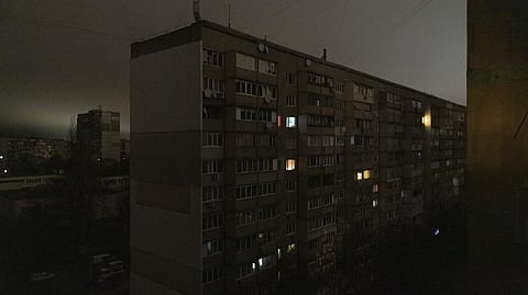 Windows of an apartment building are illuminated during a blackout in central Kyiv, Ukraine.