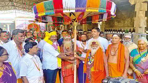 Vellore Collector Kumaravel Pandian and AIADMK?s urban district secretary SRK Appu with an umbrella presented by Sri Jalakanteswarar Temple to Sri Arunachaleswarar Temple on Wednesday