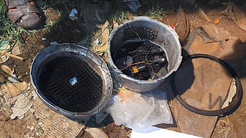 A cooker fitted with detonator, wires and batteries found during investigation