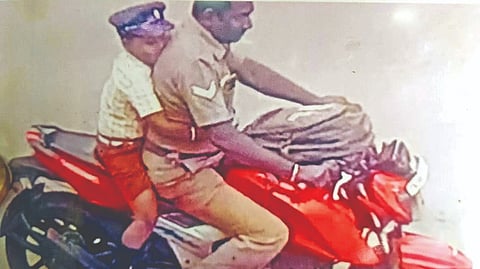 CCTV footage shows the cop riding the stolen bike