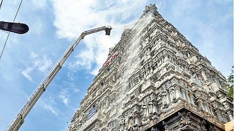 A sky crane washing a gopuram in Sri Arunachaleshwarar Temple in Tiruvannamalai on Friday
