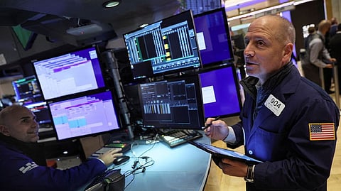 Traders work on the floor of the New York Stock Exchange (NYSE) in New York City
