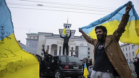 Ukrainians gather in downtown to celebrate the recapturing their city