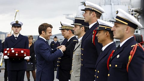 French President Emmanuel Macron decorates soldiers
