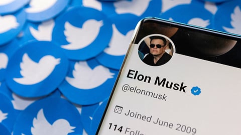 Elon Musk's Twitter profile is seen on a smartphone