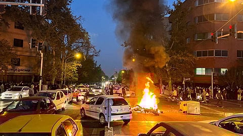 A police motorcycle burned during protests