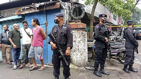 Police officers stand guard