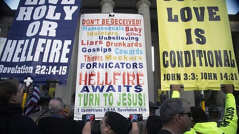 Attendees congregate at a rally against gender-affirming care at War Memorial Plaza in Nashville, Tenn.