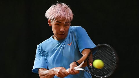 Chinese tennis player Baoluo Zheng