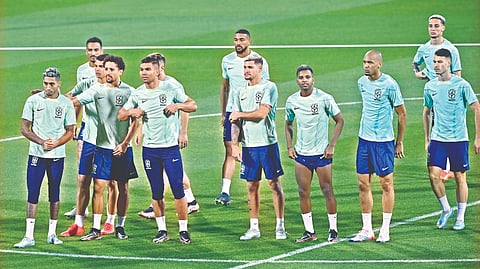 Brazil?s players gather during a training session on Sunday.