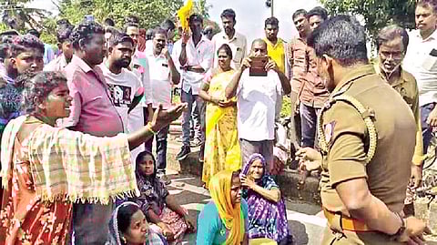 Residents staging a protest on the Tiruvallur-Redhills Road