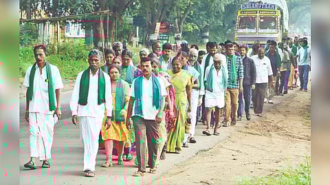 Annur farmers taking out a protest march to Coimbatore on Monday.