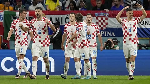 Croatia's Ivan Perisic, right, celebrates after scoring his side's first goal during the World Cup round of 16 soccer match between Japan and Croatia at the Al Janoub Stadium in Al Wakrah, Qatar.